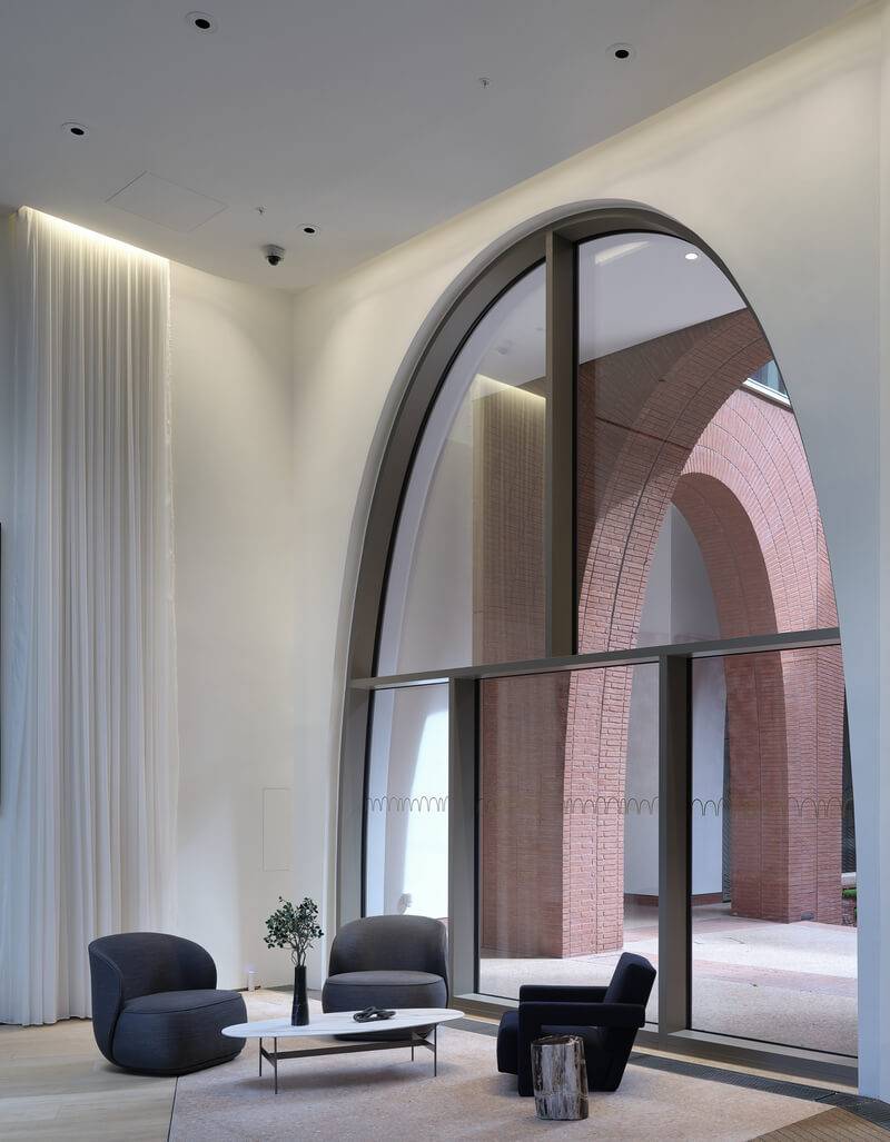 Cadence lobby with arched glazing and decorative plaster surfaces