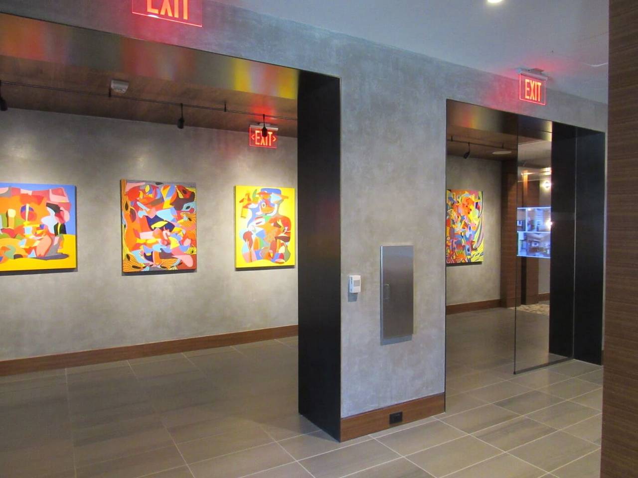 Gallery corridor at The Signature in Reston with spatulata plaster walls and Koncrete columns