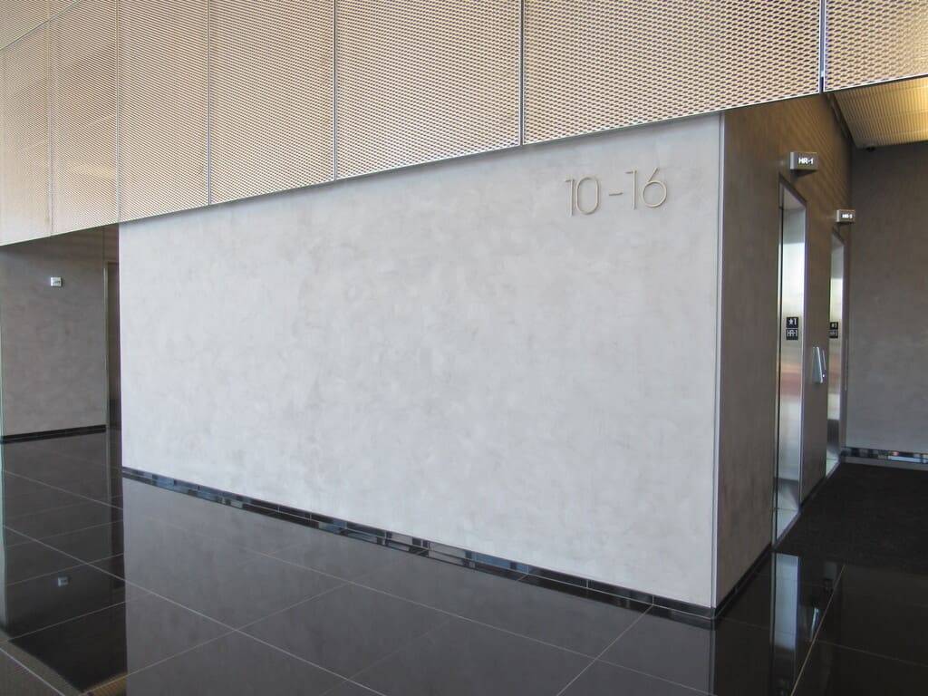 Lobby corridor at Reston Station with a spatulata-textured plaster wall