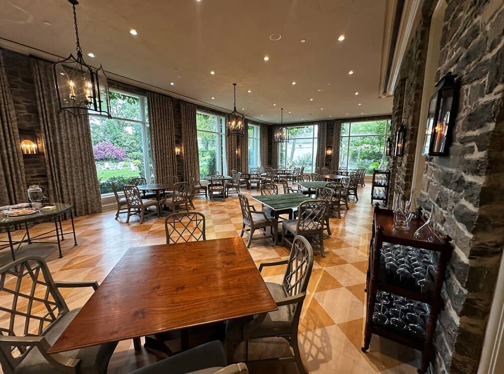 Country club dining room with timber panelling and an acoustic plaster ceiling