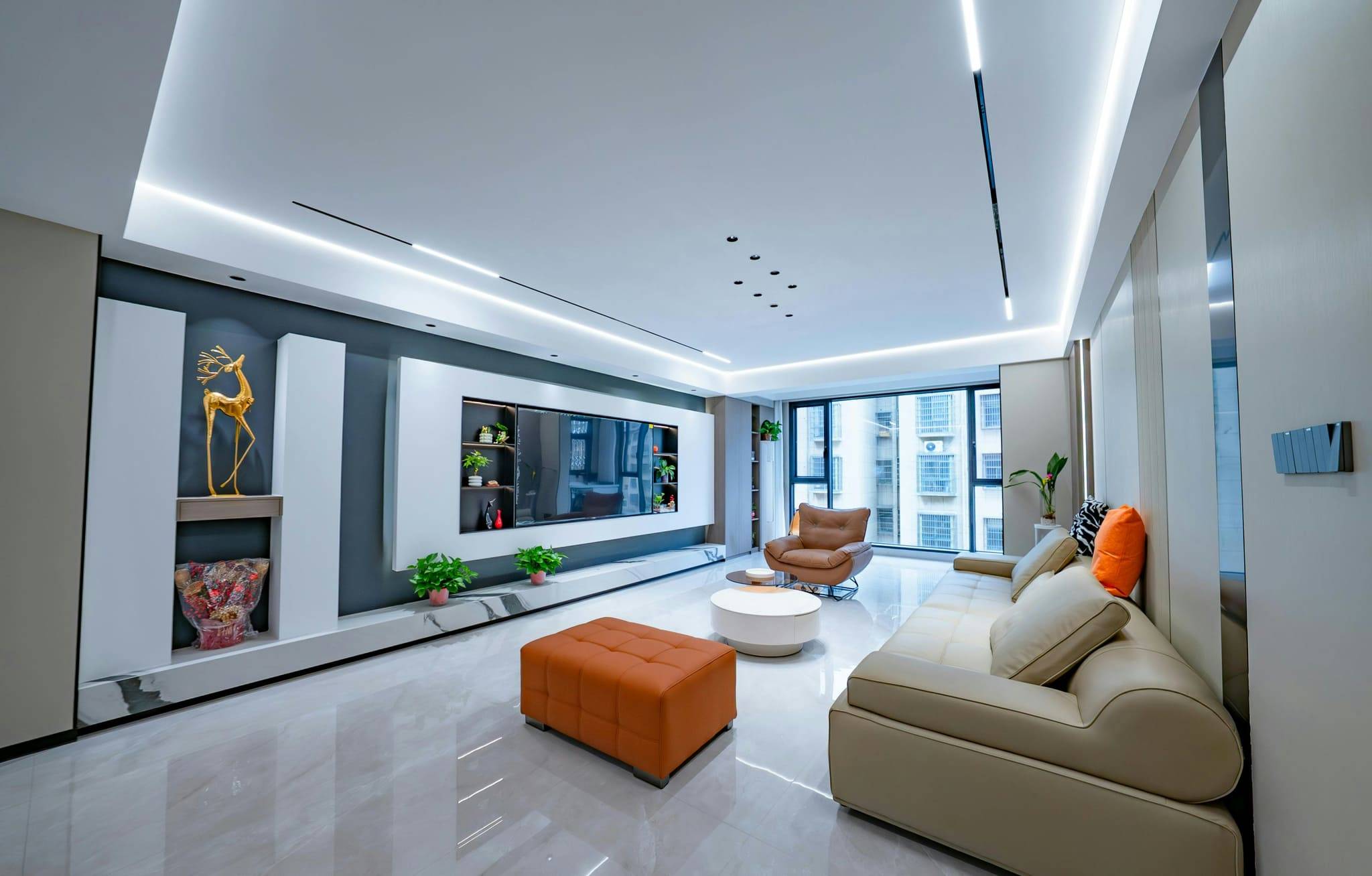 Living room with a plaster feature wall and cove-lit ceiling