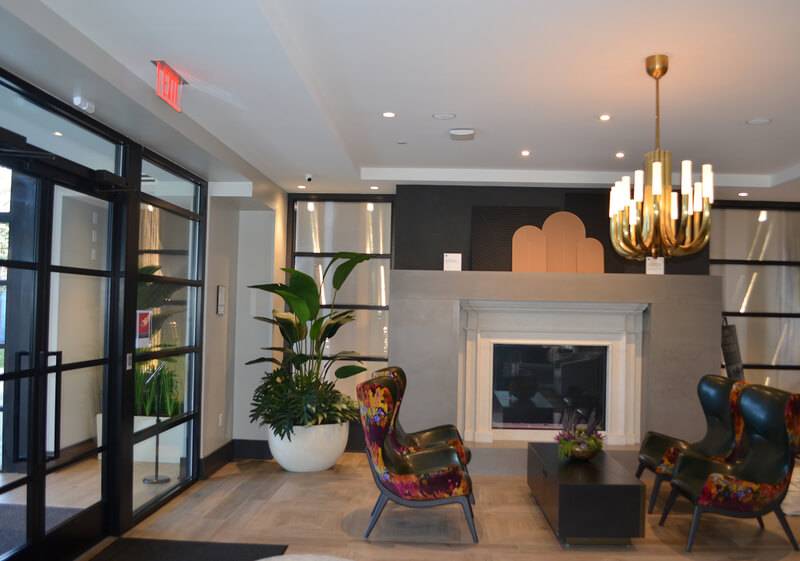 Living area fireplace with a hand-troweled plaster mantel and chimney breast